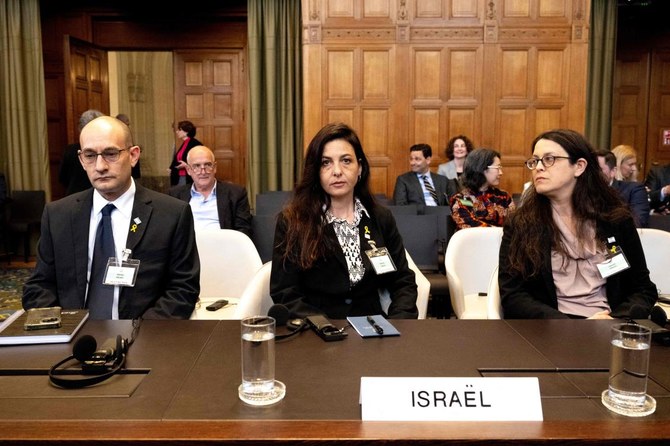 Israel's deputy Attorney General for International Law Gilad Noam, Principal Deputy Legal Adviser of the Ministry of Foreign Affairs of Isrel Tamar Kaplan Tourgman and Legal Adviser atbIsraeli Embassy to the Netherlands Avgail Frisch Ben Avraham wait to hear the arguments of South Africa's legal team as part of South Africa case against Israel over Rafah offensive. (AFP)