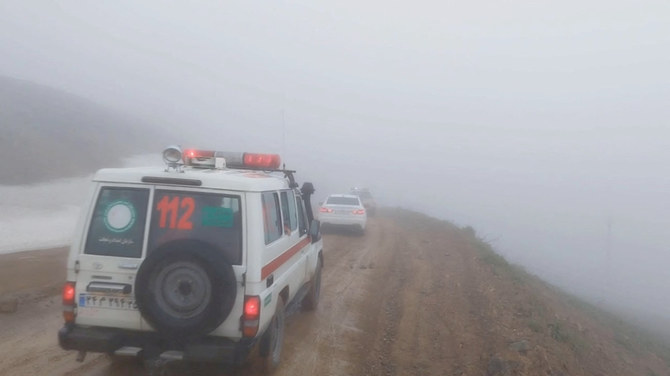​ Rescue vehicles drive on foggy weather following a crash of a helicopter carrying Iran's President Ebrahim Raisi, in Varzaqan , East Azerbaijan Province, Iran, on May 19, 2024. (West Asia News Agency via REUTERS)