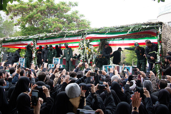 People attend a funeral ceremony for the late Iranian President Ebrahim Raisi in Tabriz, East Azerbaijan Province on May 21, 2024. (West Asia News Agency via Reuters)