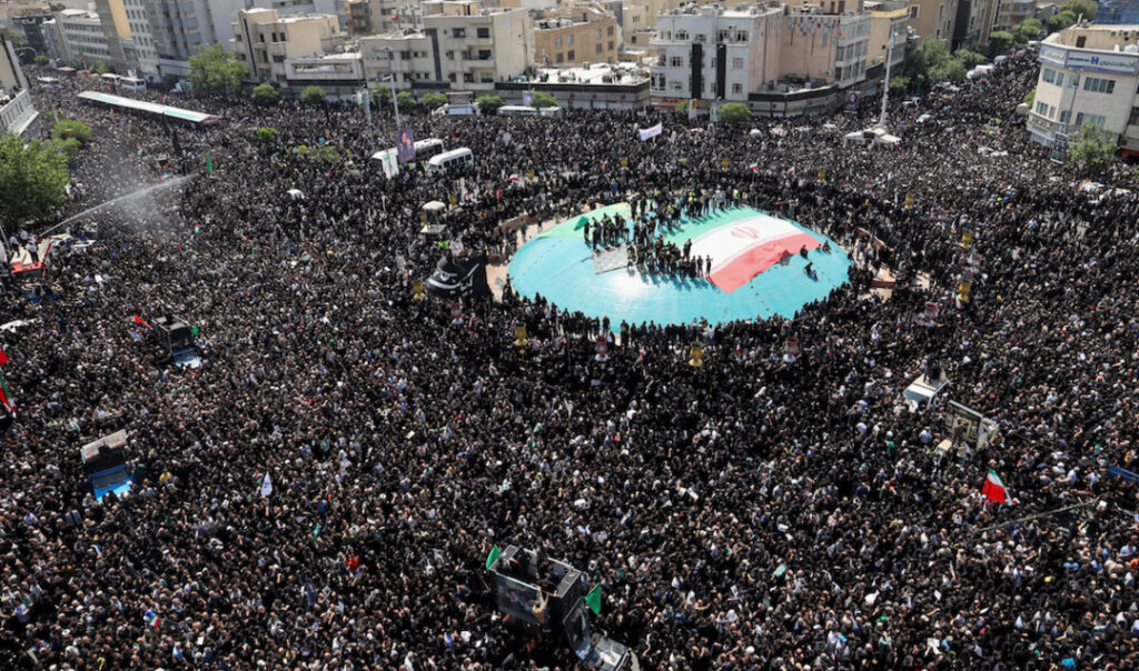 Mourners attend the funeral for Iran’s President Ebrahim Raisi, Foreign Minister Hossein Amirabdollahian and others in Tehran on May 22, 2024. (WANA via Reuters)