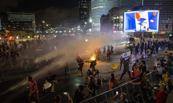 Police use water cannon to disperse demonstrators during a protest against Israeli Prime Minister Benjamin Netanyahu's government, and calling for the release of hostages held in the Gaza Strip by the Hamas militant group, in Tel Aviv, Israel, Saturday, May 25, 2024. (AP)