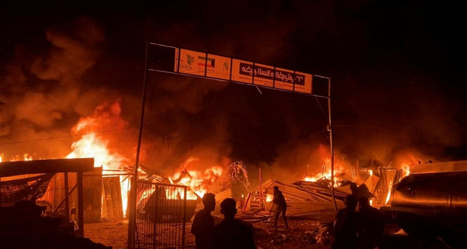 Fire rages following an Israeli strike on an area designated for displaced Palestinians in Rafah , southern Gaza Strip, in this still picture taken from a video on May 26, 2024. (REUTERS/Reuters TV)