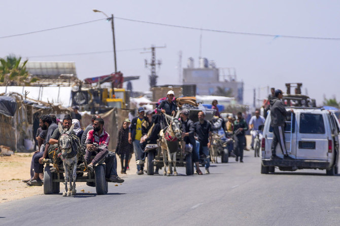 Displaced Palestinians arrive in central Gaza after fleeing from the southern Gaza city of Rafah in Deir al Balah, Gaza Strip, on Thursday, May 9, 2024. The Israeli army has ordered tens of thousands of people to evacuate Rafah as it conducts a ground operation there. (AP)