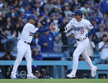 Shohei Ohtani #17 of the Los Angeles Dodgers celebrates his solo home run with Dino Ebel #91, to take a 3-0 lead over the Atlanta Braves, during the third inning at Dodger Stadium on May 04, 2024 in Los Angeles, California. (AFP)
