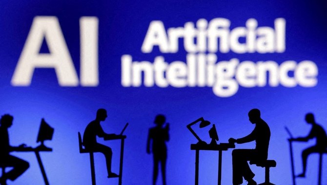 Figurines with computers and smartphones are seen in front of the words ‘Artificial Intelligence AI,’ Feb. 19, 2024. (Reuters)