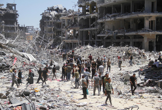 Palestinians inspect the damage after Israeli forces withdrew from Jabalia refugee camp, following a raid, in the northern Gaza Strip, May 31, 2024. (Reuters)
