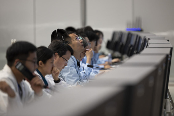 Specialists work at the Beijing Aerospace Control Center in Beijing on June 2, 2024 as Chang’e-6 lunar probe looks set to begin its historic journey back to Earth from the moon’s far side after collecting samples. (Xinhua via AP)