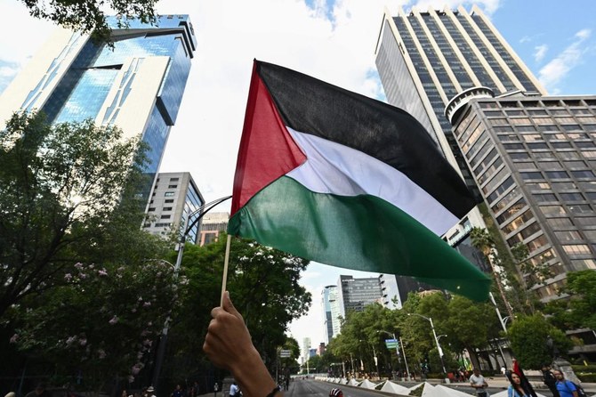 A demonstrator waves a flag of Palestine during a pro-Palestinian rally in front of the US embassy in Mexico City on June 1, 2024. (File/AFP)