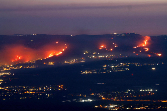 Fires burn as a result of rockets launched from Lebanon into northern Israel, next to the city of Kiryat Shmona near the Lebanon border, on June 3, 2024, amid ongoing cross-border clashes between Israeli troops and Hezbollah fighters. (AFP)