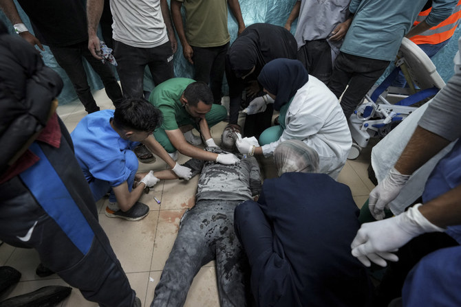 A Palestinian wounded in the Israeli bombardment of the Gaza Strip is treated at a hospital in Deir al Ballah on June 5, 2024. (AP)