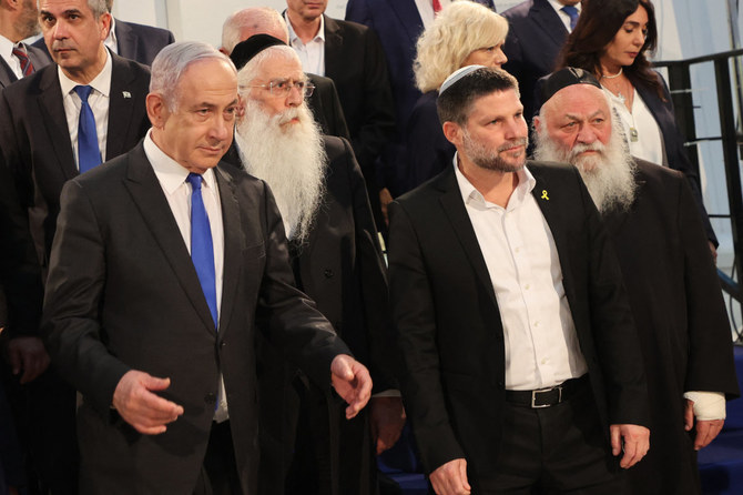 Israeli Prime Minister Benjamin Netanyahu (L) and Finance Minister Bezalel Smotrich (2nd R) arrive for a cabinet meeting at the Bible Lands Museum in Jerusalem on June 5, 2024. (Pool / AFP)