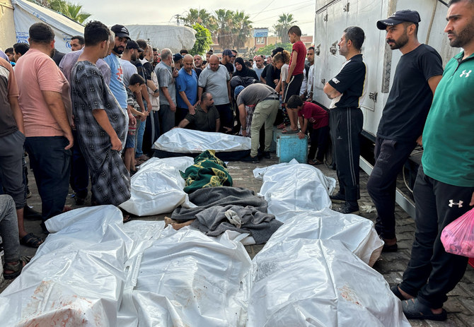 Mourners gather next to the bodies of Palestinians killed in Israeli strikes, during their funeral at Al-Aqsa hospital in Deir Al-Balah, in central Gaza Strip, on June 5, 2024. (REUTERS)
