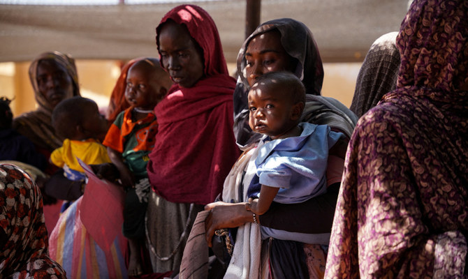 A handout photograph, shot in January 2024, shows women and babies at the Zamzam displacement camp, close to El Fasher in North Darfur, Sudan. (Reuters)