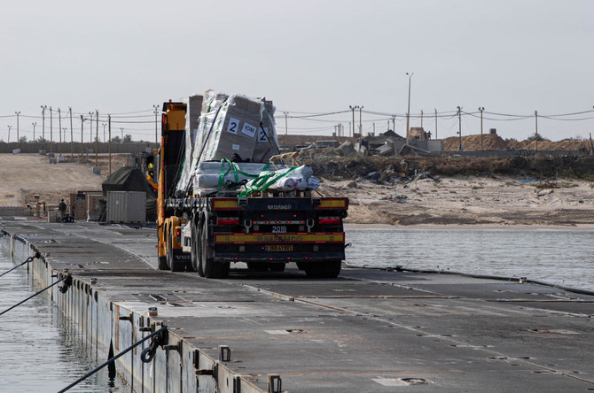 A truck carries humanitarian aid across Trident Pier, a temporary pier to deliver aid, off the Gaza Strip, amid the ongoing conflict between Israel and the Palestinian Islamist group Hamas, near the Gaza coast. (File/Reuters)