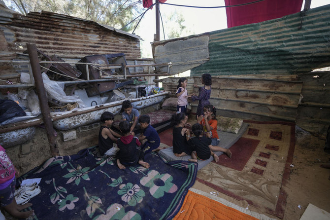 Palestinian children play in Khan Younis, Gaza Strip, Monday, June 10, 2024. (AP)