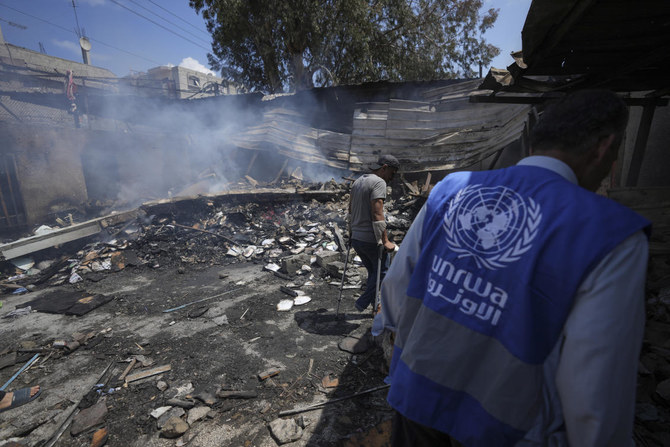 Palestinians look at the destruction after an Israeli strike on a school run by UNRWA, the U.N. agency helping Palestinian refugees, in Nuseirat, Gaza Strip, May 14, 2024. (AP)