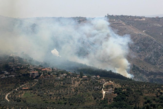Smoke billows from fires ignited by Israeli shelling on the forested areas of the southern Lebanese village of Deir Mimas on Jun. 15, 2024, amid ongoing cross-border clashes between Israeli troops and Hezbollah fighters. (AFP)