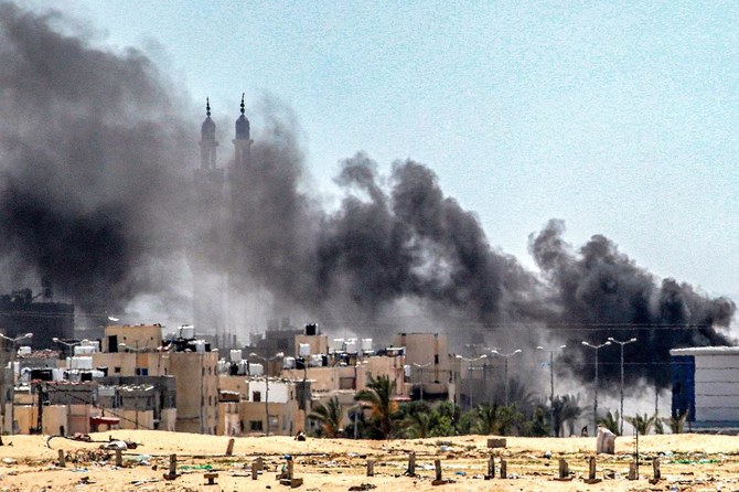 Smoke plumes billow during ongoing battles in the Sultan neighborhood in the northwest of Rafah in the southern Gaza Strip on Jun. 18, 2024 amid the ongoing conflict in the Palestinian territory between Israel and Hamas. (AFP)