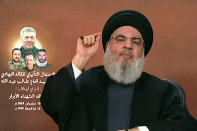 An image grab taken from Hezbollah's Al-Manar TV on June 19, 2024, shows Hezbollah chief Hassan Nasrallah giving a televised address from an undisclosed location in Lebanon. (AFP)