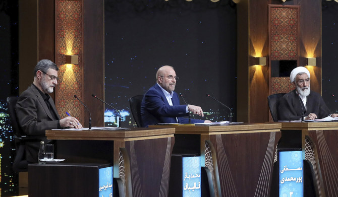 Iran's Parliament Speaker Mohammad Bagher Qalibaf, a presidential candidate for the June 28 election, center, speaks as other candidates Mostafa Pourmohammadi, a former Minister of Justice, right, and Amirhossein Ghazizadeh Hashemi, Vice President of late Ebrahim Raisi, listen in a debate of the candidates at the TV studio in Tehran, Iran, Thursday, June 20, 2024. (AP)