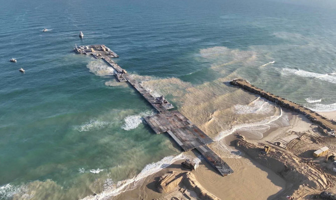 Ships are seen near a temporary floating pier built to receive humanitarian aid in the Gaza Strip in Gaza Beach, in this handout picture obtained by Reuters on May 18, 2024. (Reuters)