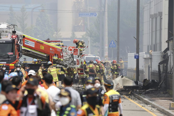 Firefighters work at the site of a burnt lithium battery manufacturing factory in Hwaseong, South Korea on June 24, 2024. (Yonhap via AP)