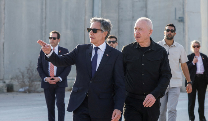 US Secretary of State Antony Blinken gestures as he walks with Israeli Defense Minister Yoav Gallant, at the Kerem Shalom border crossing, Israel, May 1, 2024. (REUTERS)