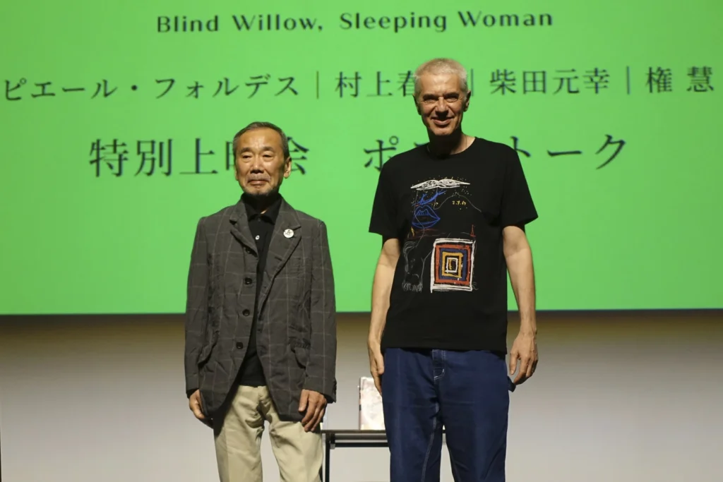 Novelist Haruki Murakami and film director Pierre Földes at the end of a talk session after a screening of 'Blind Willow, Sleeping Woman,' an animated film adapted from the Japanese author's short stories, in Tokyo. (AP Photo/Mari Yamaguchi)