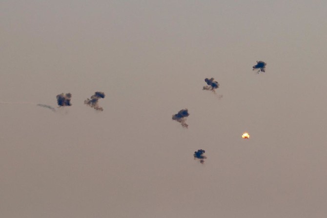 A rocket fired from southern Lebanon is intercepted by Israel’s Iron Dome air defense system over the Upper Galilee region in northern Israel on Jul. 23, 2024. (AFP)