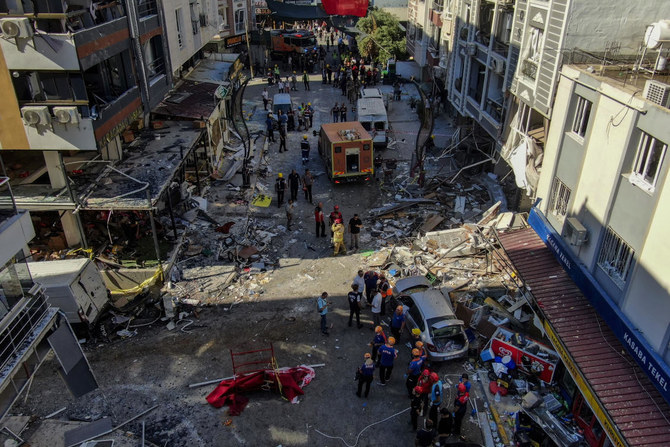 Firefighters and emergency team members work during the aftermath of an explosion in a restaurant in Izmir, western Turkiye, Sunday, June 30, 2024. (AP)