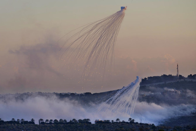 Shells that appears to be white phosphorus from Israeli artillery explode over Dahaira, a Lebanese border village with Israel (AP)