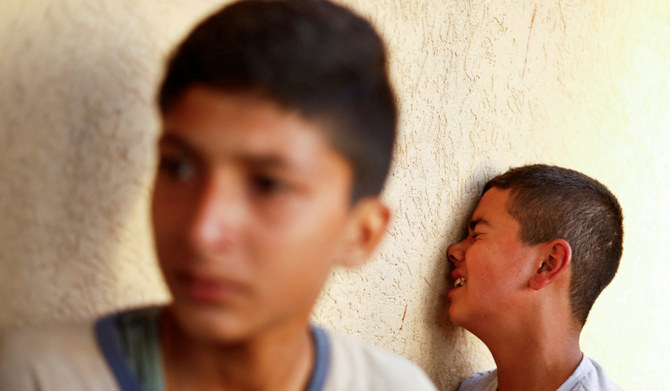 Mourners react next to the bodies of Palestinians killed in Israeli strikes in Khan Younis, in the southern Gaza Strip, July 5, 2024. (REUTERS)