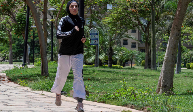 Palestinian Karate-ka, 18-year-old Mais Elbostami, trains in a park near her home, east of the Egyptian capital Cairo on June 25, 2024. (AFP)