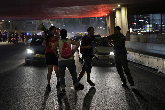 Police disperse protesters as they block a road during a demonstration against Israeli Prime Minister Benjamin Netanyahu's government and a call for the release of hostages in Gaza, amid the Israel-Hamas conflict, in Tel Aviv, Israel. (Reuters)