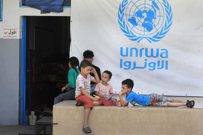 Palestinian children who fled with their parents from their houses in the Palestinian refugee camp of Ein El-Hilweh, gather in the backyard of an UNRWA school. (AP/File Photo)