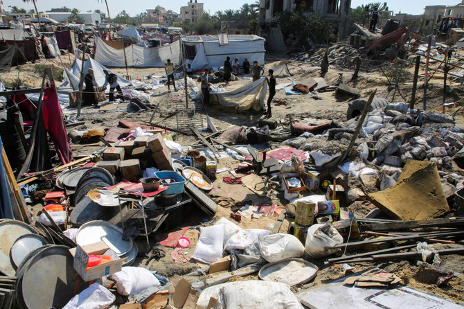 Palestinians inspect the damage following an Israeli strike at a tent camp in Al-Mawasi area, amid Israel-Hamas conflict, in Khan Younis in the southern Gaza Strip July 13, 2024. (Reuters)