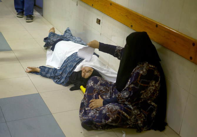 A Palestinian woman wounded in an Israeli strike is assisted at Nasser hospital following an Israeli strike at a tent camp, amid Israel-Hamas conflict, in Khan Younis in the southern Gaza Strip July 13, 2024. (Reuters)