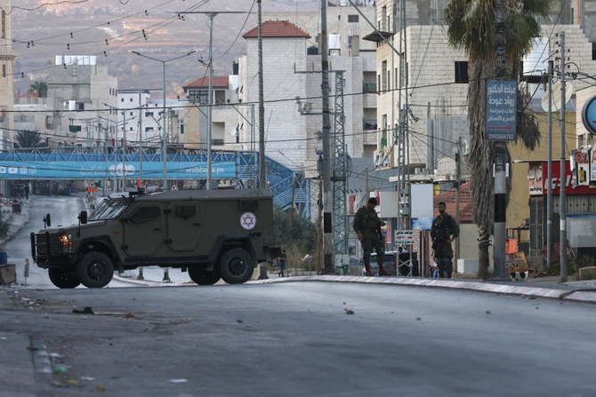 Israeli security forces close-off a main entrance to Huwara town in the occupied West Bank following reported attacks by Israeli settlers on July 19, 2024. (AFP)