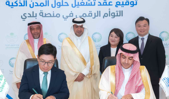 The agreement was signed in the presence of Housing Minister Majid Al-Hogail. NHC