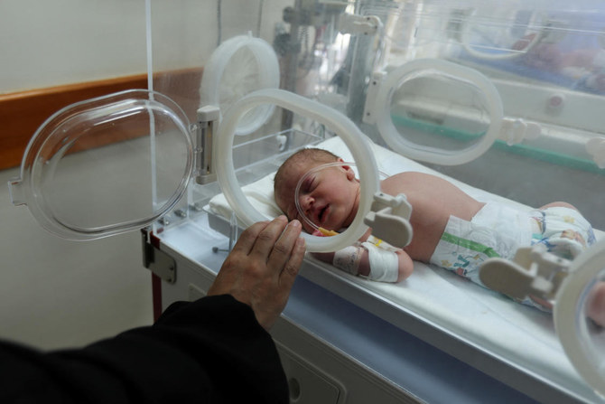 Palestinian baby Malek Yassin, who was saved from the womb of his mother Ola Al-Kurd, who was killed in an Israeli strike, according to medics, amid the ongoing Israel-Hamas conflict, lies in an incubator at a hospital in central Gaza Strip July 20, 2024. (REUTERS)