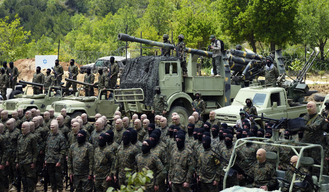 Fighters from the Lebanese militant group Hezbollah carry out a training exercise in Aaramta village in the Jezzine District, southern Lebanon, Sunday, May 21, 2023. (AP)