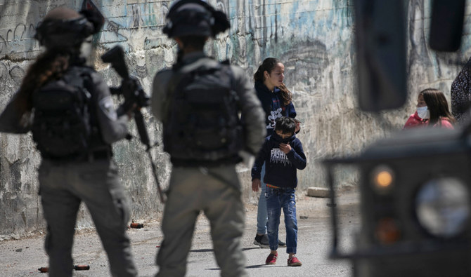 Israeli security members deploy as Palestinians commemorating land day demonstrate in protest of settler visits to archaeological and historical sites in the Palestinian village of Sebastia, northwest of Nablus in the occupied West Bank, on March 30, 2021. (AFP/File)