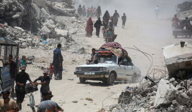 Displaced Palestinians return to eastern Khan Yunis following reports of Israeli forces withdrawing from the area in the southern Gaza Strip on July 30, 2024, amid the ongoing conflict between Israel and the Palestinian Hamas militant group. (AFP)