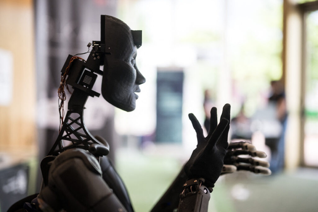 Japanese companies' use of generative AI has been limited to taking meeting minutes and creating emails and documents. (AFP)