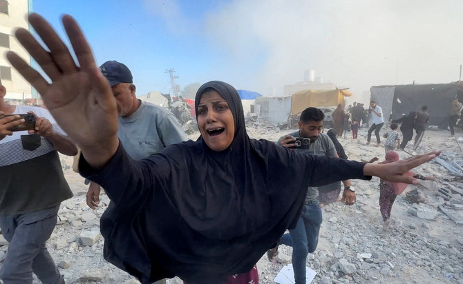 Palestinians react, following an Israeli strike near a UN-run school sheltering displaced people in Khan Younis, in the southern Gaza Strip on July 3, 2024. (Reuters)