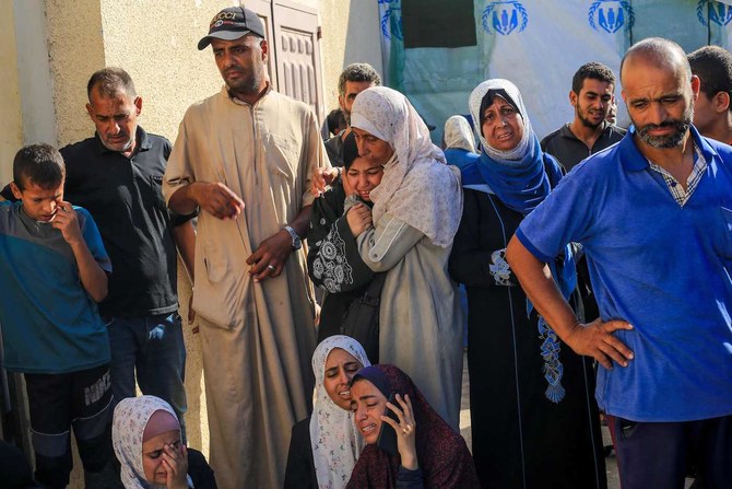 Palestinians mourn over the bodies of loved ones following Israeli bombardment in Deir El-Balah in the central Gaza Strip on July 10, 2024. (AFP)