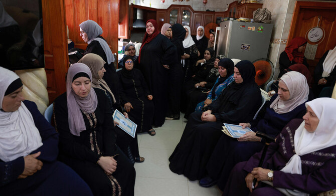 Women gather to offer condolences to the family of a 23-year-old Palestinian man, a day after he was killed during an attack by Jewish settlers on the village of Jit near Nablus in the occupied West Bank, on August 16, 2024. (AFP)