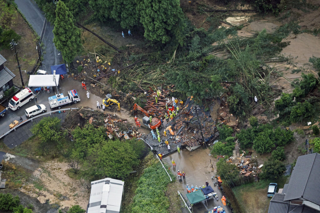 An aerial view shows rescue workers conducting search and rescue operation at a landslide site caused by a heavy rain due to the approach of Typhoon Shanshan in Gamagori, Aichi Prefecture, central Japan August 28, 2024, in this photo taken by Kyodo. (Kyodo via Reuters)