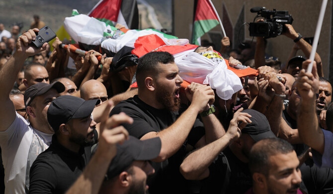 Mourners carry the body of Palestinian Rasheed Mahmoud Sadah, 23, who was killed during a rampage by Israeli settlers, during his funeral in the West Bank village of Jit, near Nablus, Friday, Aug. 16, 2024. (AP)