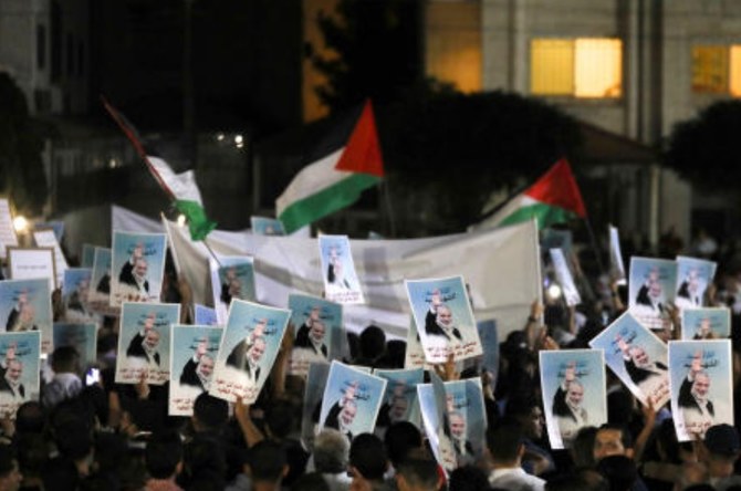 People protest following the assassination of Hamas leader Ismail Haniyeh in Iran, near the Israeli embassy in Amman on Jul. 31, 2024. (Reuters)